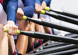 A crew team rowing a boat in tandem