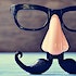 A pair of glasses with nose and mustache attached