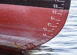 A tide mark on a boat in the water