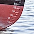 A tide mark on a boat in the water