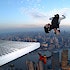 BASE jumpers jumping off a ledge