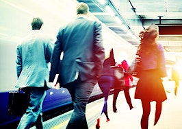 Passengers commuting to work via train