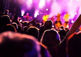 A rear view of an audience at a pop concert