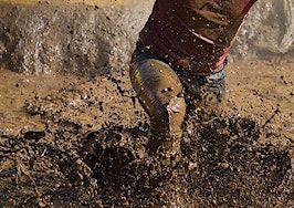 A racer running through mud