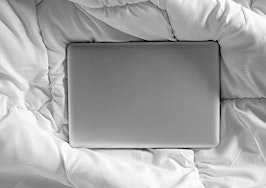a laptop in bed