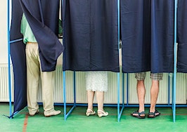 A group of people in a voting booth
