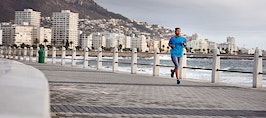 A woman running on a pier