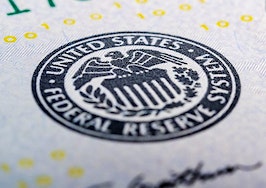 A close-up of the Federal Reserve seal on a $20 bill