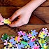 A child's hands putting a jigsaw puzzle together