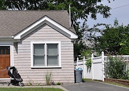 A small home with a baby stroller in front