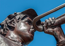A statue playing a trumpet