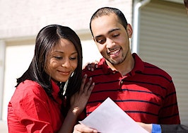 A couple looking at a home with an agent