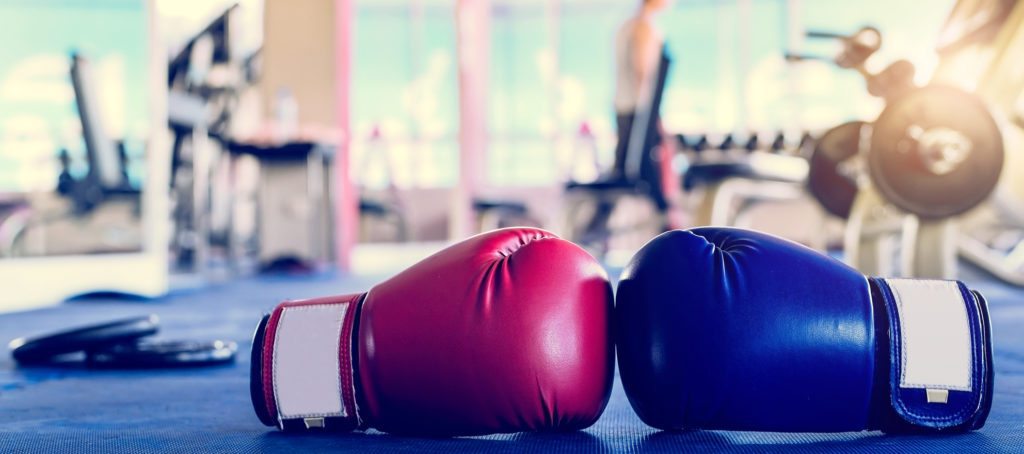 A pair of boxing gloves, red and blue