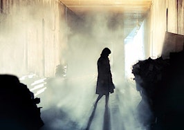 A woman's silhouette in a haunted room