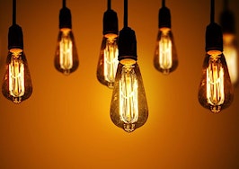 A series of light bulbs on a warm gradient background