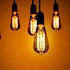 A series of light bulbs on a warm gradient background