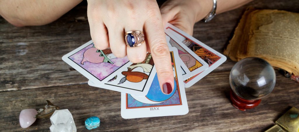 A female fortune teller with Tarot cards