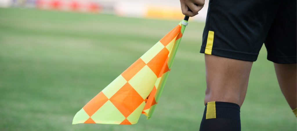 An umpire waving a flag
