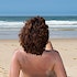 A woman on a nudist beach