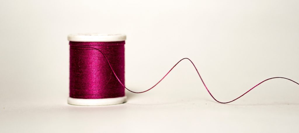 Spool of thread yarn unraveling