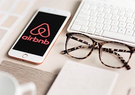 Airbnb logo on smartphone