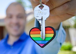 Man holding a rainbow keychain