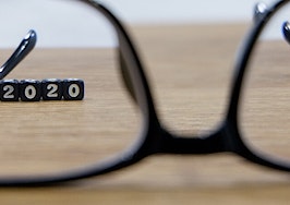 Looking through glasses to focus on the year 2020