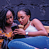 Two women looking at smartphone